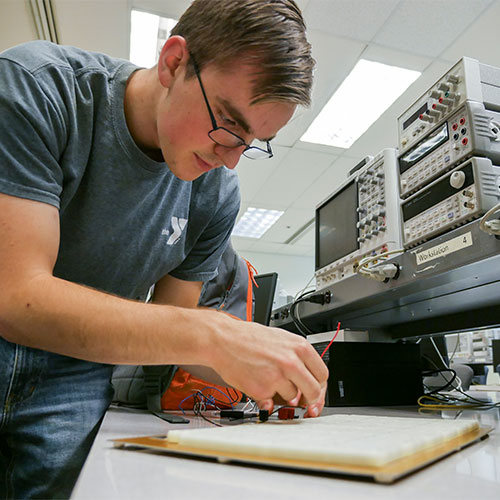 Electrical engineering student working in a lab