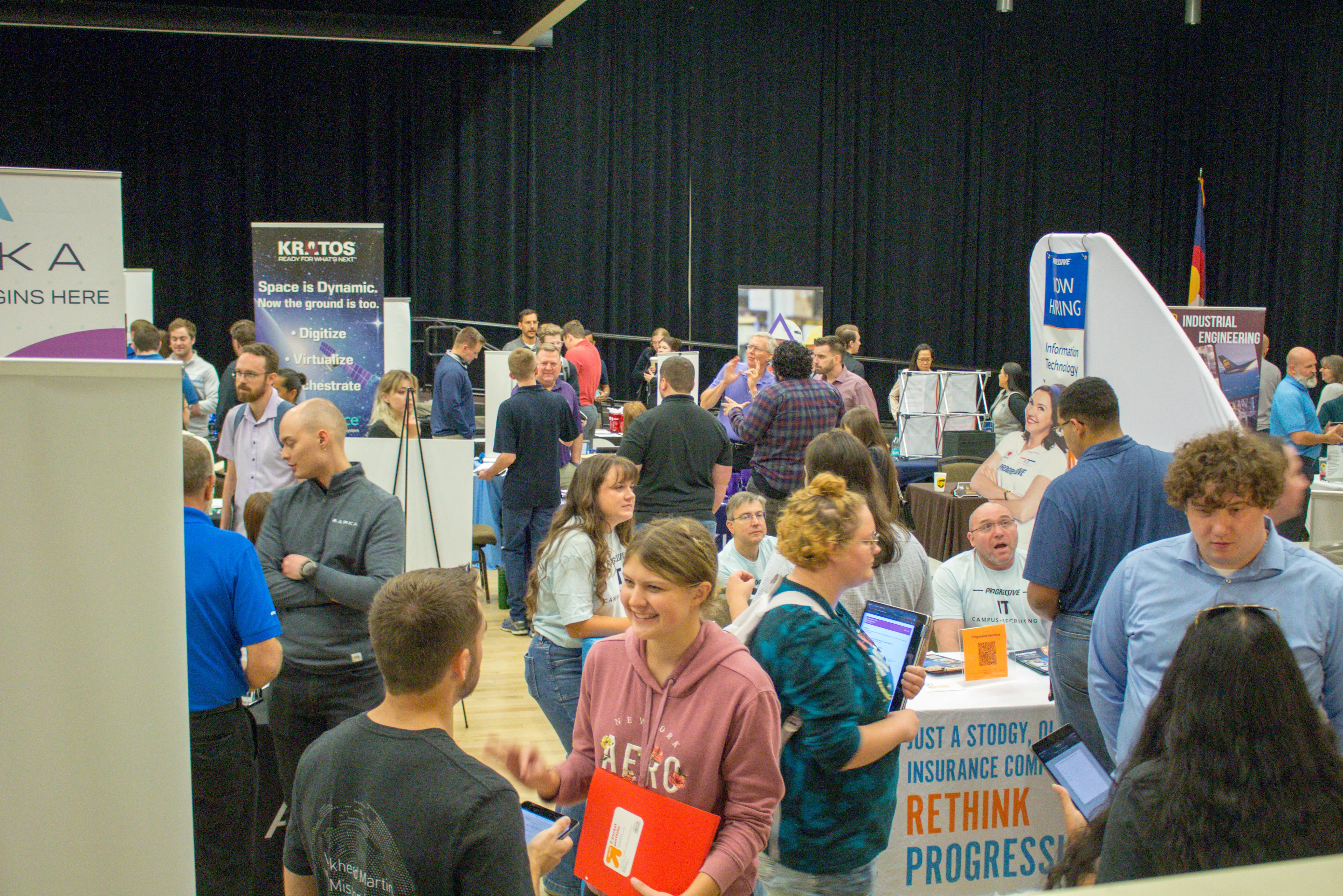 Engineering college students meeting with employers at a hiring event